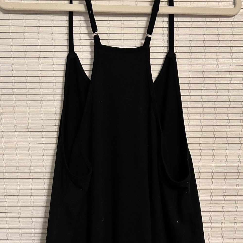 Black loose fit shorts jumpsuit with pockets.
